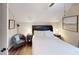 Well-lit bedroom with hardwood floors, a ceiling fan, and comfortable furnishings at 40 Luther Knight Se Rd, Cartersville, GA 30121