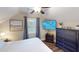 Cozy bedroom with a sloped ceiling, a ceiling fan, a TV, and hardwood floors at 40 Luther Knight Se Rd, Cartersville, GA 30121