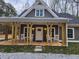 Charming home exterior with rocking chairs and a covered front porch offering a relaxing outdoor space at 40 Luther Knight Se Rd, Cartersville, GA 30121
