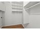 Spacious walk-in closet featuring ample shelving and rod space for organized storage solutions at 1421 Peachtree Ne St # 211, Atlanta, GA 30309