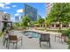 Serene common area with comfortable seating and a tranquil water fountain, set against a cityscape backdrop at 1421 Peachtree Ne St # 211, Atlanta, GA 30309