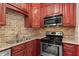 Elegant kitchen featuring stainless steel appliances, granite countertops, and ample storage at 1421 Peachtree Ne St # 211, Atlanta, GA 30309