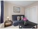 A comfortable blue sofa and closet make for a cozy living space at 1421 Peachtree Ne St # 211, Atlanta, GA 30309