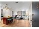 Bright living room with bar seating, wood floors, stylish rug, and ample natural light at 1421 Peachtree Ne St # 211, Atlanta, GA 30309