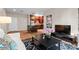 Inviting living room with modern furnishings, hardwood floors and a view into the kitchen at 1421 Peachtree Ne St # 211, Atlanta, GA 30309