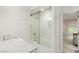 Elegant bathroom with a sliding glass shower door and a marble countertop, offering a modern touch at 2890 Howell Mill Rd, Atlanta, GA 30327