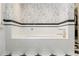 Clean bathroom with a deep soaking tub, neutral tile, and stylish fixtures at 2890 Howell Mill Rd, Atlanta, GA 30327