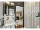 Cozy bathroom leading to an office, showcasing a stylish sink and patterned shower curtain at 2890 Howell Mill Rd, Atlanta, GA 30327