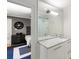 Bathroom boasts marble counters, a glass-enclosed shower, accessible from the nearby cozy bedroom space at 2890 Howell Mill Rd, Atlanta, GA 30327
