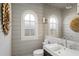 Bathroom featuring shiplap, modern fixtures, a sleek sink, and stylish lighting at 2890 Howell Mill Rd, Atlanta, GA 30327