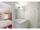 En suite bathroom featuring a marble countertop, drawers, and glass shower door at 2890 Howell Mill Rd, Atlanta, GA 30327
