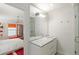 Bright bathroom boasts marble counters, a large mirror, and a glass-enclosed shower, offering a spa-like retreat at 2890 Howell Mill Rd, Atlanta, GA 30327