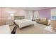 Spacious bedroom featuring lilac accents, soft lighting, and ample room for a bed, couch, and desk at 2890 Howell Mill Rd, Atlanta, GA 30327