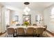 Elegant dining room featuring a marble table, modern chandelier, and sophisticated decor at 2890 Howell Mill Rd, Atlanta, GA 30327