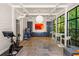 Bright exercise room with slate floors, modern lighting, and large windows at 2890 Howell Mill Rd, Atlanta, GA 30327
