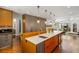 Open kitchen featuring a large island with bar stool seating and views to the living area at 2890 Howell Mill Rd, Atlanta, GA 30327