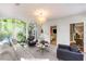Bright living room with large windows, neutral tones, and stylish decor at 2890 Howell Mill Rd, Atlanta, GA 30327
