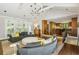 Open living room with vaulted ceilings offers natural light and convenient access to the kitchen at 2890 Howell Mill Rd, Atlanta, GA 30327