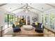 Modern living room with vaulted ceilings, black framed windows and comfortable seating at 2890 Howell Mill Rd, Atlanta, GA 30327