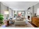 Elegant living room with a fireplace, comfortable seating, and stylish decor at 2890 Howell Mill Rd, Atlanta, GA 30327