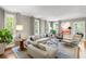 Bright and airy living room with large windows and neutral-toned furnishings at 2890 Howell Mill Rd, Atlanta, GA 30327