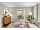 Comfortable living room with modern decor, hardwood floors, and a seamless flow to the dining area at 2890 Howell Mill Rd, Atlanta, GA 30327