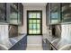Butler's pantry boasts stainless countertops, navy cabinetry and a tiled floor at 2890 Howell Mill Rd, Atlanta, GA 30327