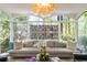 Inviting sunroom with floor-to-ceiling windows offering stunning views of the surrounding greenery at 2890 Howell Mill Rd, Atlanta, GA 30327