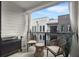 Relaxing balcony features stylish seating, a grill, and privacy curtains for a serene outdoor experience at 383 Grant Se Cir # 1634, Atlanta, GA 30315