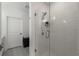 Walk-in shower with glass door and white tile in bright bathroom at 383 Grant Se Cir # 1634, Atlanta, GA 30315