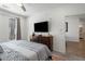 Bright main bedroom with large windows, ceiling fan, dresser, and view to bathroom at 383 Grant Se Cir # 1634, Atlanta, GA 30315