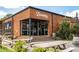 Exterior shot of Eventide Brewing featuring a brick facade, outdoor seating and rustic barrels at 383 Grant Se Cir # 1634, Atlanta, GA 30315