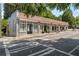 Street view of commercial building with light gray paint, red tile roof, and outdoor seating area at 383 Grant Se Cir # 1634, Atlanta, GA 30315