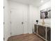 Stylish apartment entrance with modern flooring, console table, and a white door at 383 Grant Se Cir # 1634, Atlanta, GA 30315