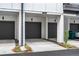 Modern townhome garages with sleek gray doors and well-maintained landscaping, offering secure parking at 383 Grant Se Cir # 1634, Atlanta, GA 30315