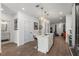 Open concept kitchen with a marble island, stainless steel appliances, and modern lighting at 383 Grant Se Cir # 1634, Atlanta, GA 30315