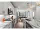 Modern kitchen featuring granite countertops, stainless steel appliances, and open dining area at 383 Grant Se Cir # 1634, Atlanta, GA 30315