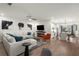 Stylish living area with a modern fireplace, plush seating, and an open layout to the kitchen at 383 Grant Se Cir # 1634, Atlanta, GA 30315