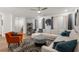 Modern living room featuring a comfortable white sectional, orange chair, and stylish rug at 383 Grant Se Cir # 1634, Atlanta, GA 30315