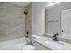 Beautifully updated bathroom features modern fixtures, stylish tile, and a granite vanity top at 3840 Natalie Way, Ellenwood, GA 30294