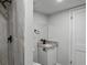Bathroom with a modern shower, vanity with a black faucet, and a white door at 3840 Natalie Way, Ellenwood, GA 30294