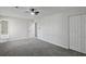 Spacious bedroom with carpet, a ceiling fan, and a view to the Primary bathroom through the doorway at 3840 Natalie Way, Ellenwood, GA 30294
