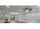 Open concept living space boasts sleek flooring, modern lighting and sliding glass doors to the backyard at 3840 Natalie Way, Ellenwood, GA 30294
