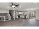 Open concept living space boasts sleek flooring, modern lighting, and stainless steel appliances at 3840 Natalie Way, Ellenwood, GA 30294