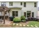 Backyard with a pergola, seating area, and lush landscaping at 690 Sienna Dr, Cumming, GA 30040