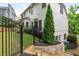 Fenced backyard with wooden stairs at 690 Sienna Dr, Cumming, GA 30040