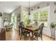 Charming dining area with hardwood floors and natural light from the large windows at 690 Sienna Dr, Cumming, GA 30040
