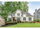 Beautiful two-story home with a well-manicured lawn and landscaping at 690 Sienna Dr, Cumming, GA 30040