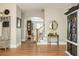 Welcoming foyer with hardwood floors and decorative mirror accents at 690 Sienna Dr, Cumming, GA 30040
