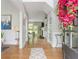 Bright foyer featuring hardwood floors, gray walls, and a view into the living area at 690 Sienna Dr, Cumming, GA 30040